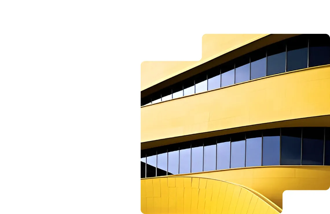 Golden façade of a contemporary building with sweeping bands of glass