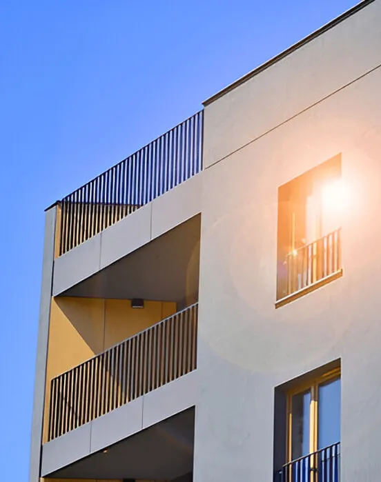 Modern office building with cantilevered balconies against a clear sky
