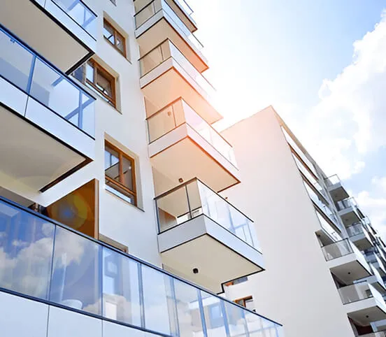 Residential building with glass-railed terraces
