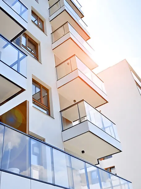 Residential apartment balconies under a clear sky